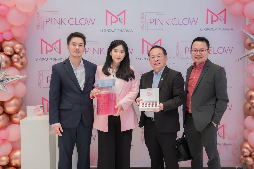 Executives presenting Pink Glow at the grand opening